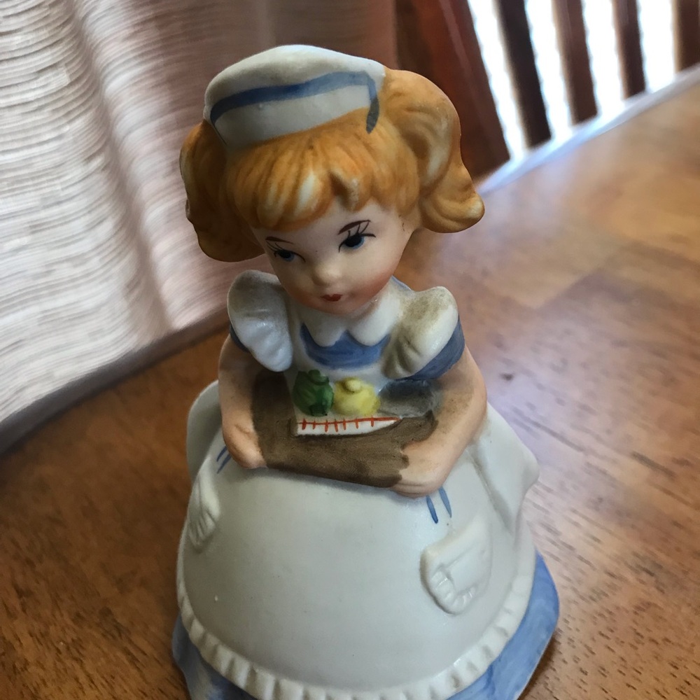Charming Ceramic Figurine with Blue and White Accents